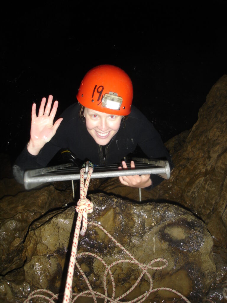 Collard Spiritual Direction - Own Our Darkness - woman descending into cave in New Zealand, author's own