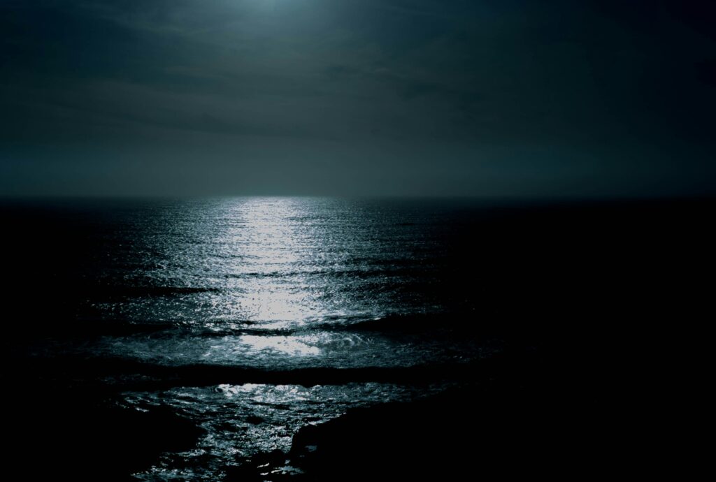 Collard Spiritual Direction - Own Our Darkness - image of ocean at night by Lukas Robertson via Unsplash